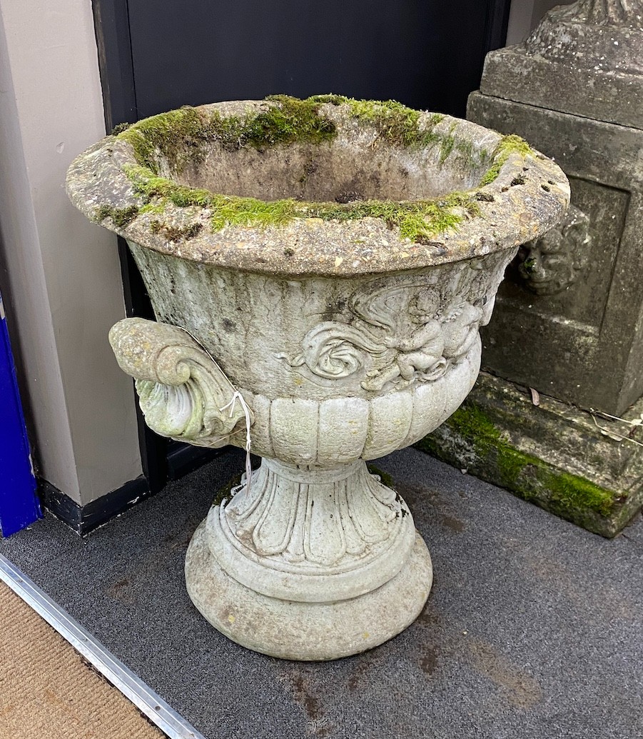A reconstituted stone campana garden urn, diameter 56cm, height 64cm